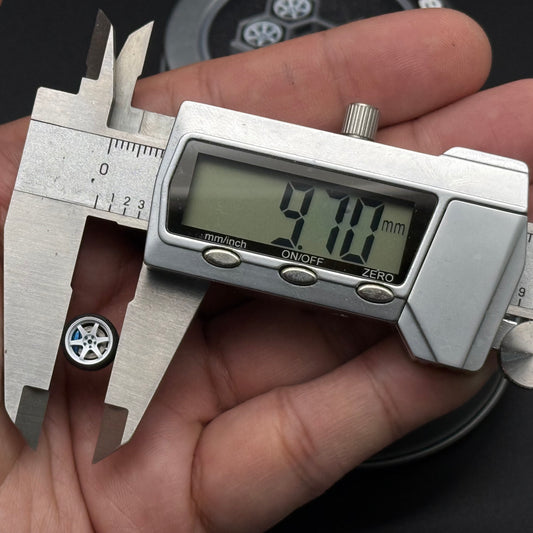 1/64 scale die-cast wheel set with silver hex frame and blue hub accents