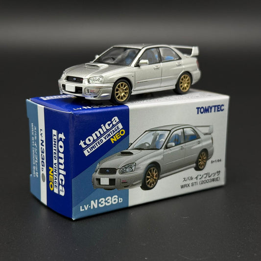 Silver Subaru WRX STI 2003 die-cast model car with gold wheels, front view