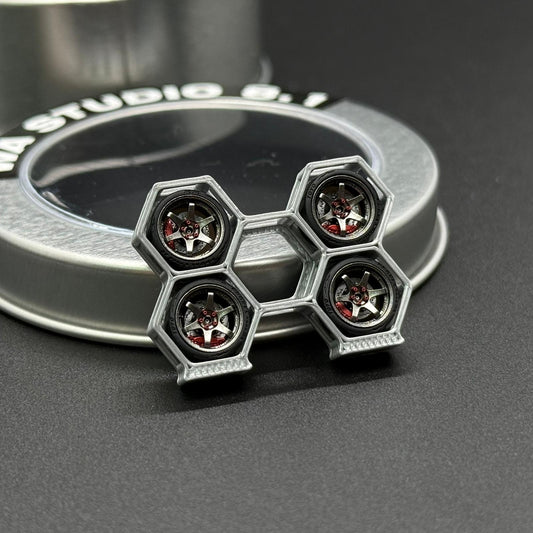 1/64 TE37 wheel with silver rim and five-hex star center with red hub details