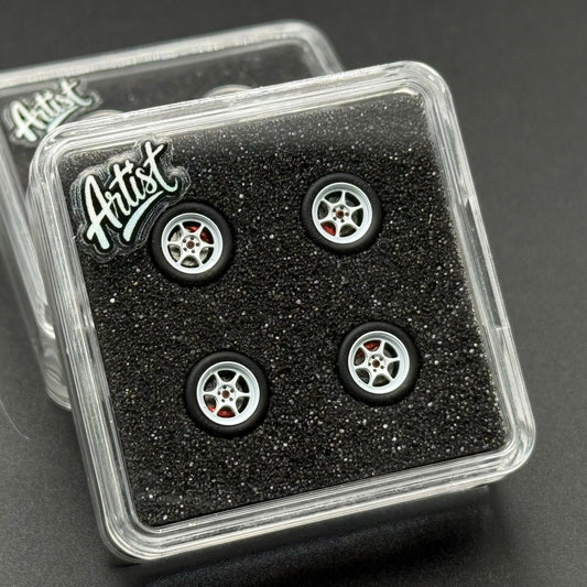 1/64 model wheel set in clear case, four silver rims with red accents on black tires