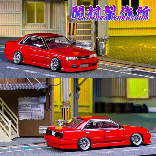 Red modified sedan scale model with front splitter and vented hood