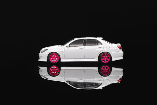 White 1/64 die-cast sports car model with pink wheels, side view