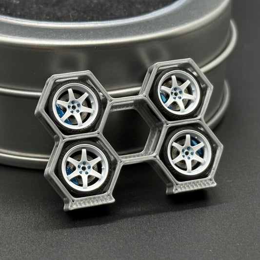1/64 scale die-cast wheels in silver hex layout with four blue hub accents