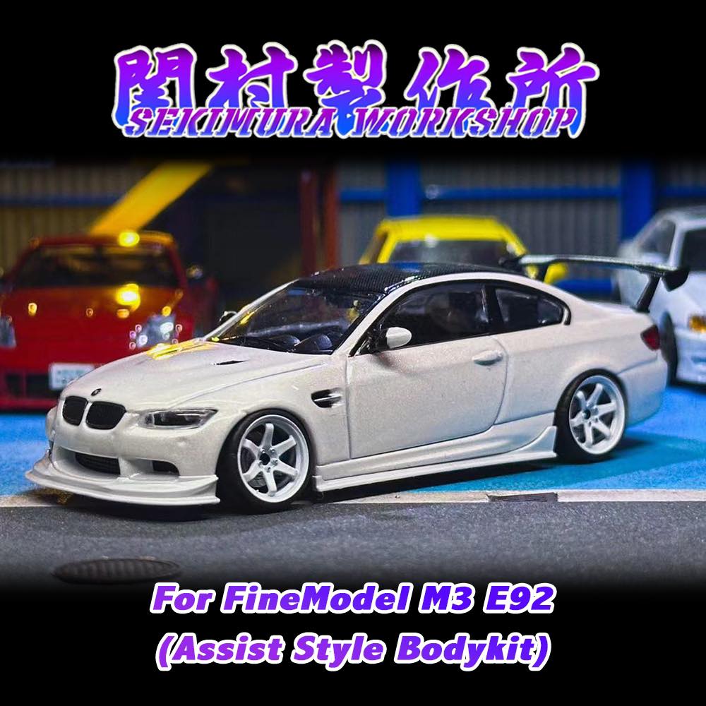 White assist-style bodykit on model coupe, front lip and side skirts