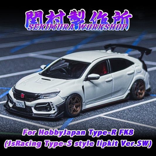 White sports car model with black front lip kit