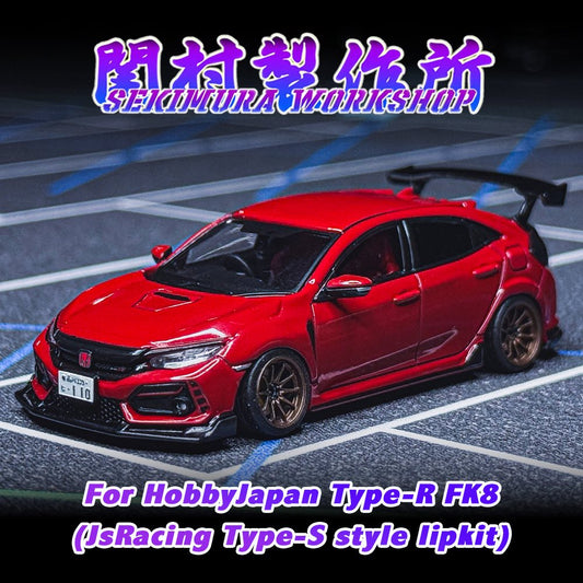 Red sports car model with black front lip kit