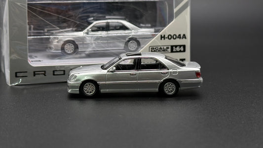 Dark silver die-cast sedan model, side 3/4 view with alloy-style wheels