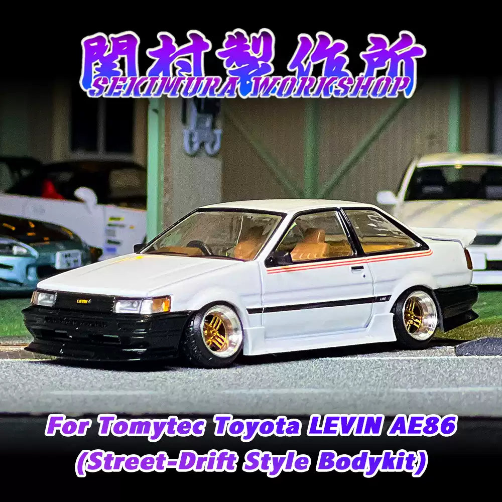 White Toyota LEVIN AE86 bodykit model car with black front bumper and gold wheels