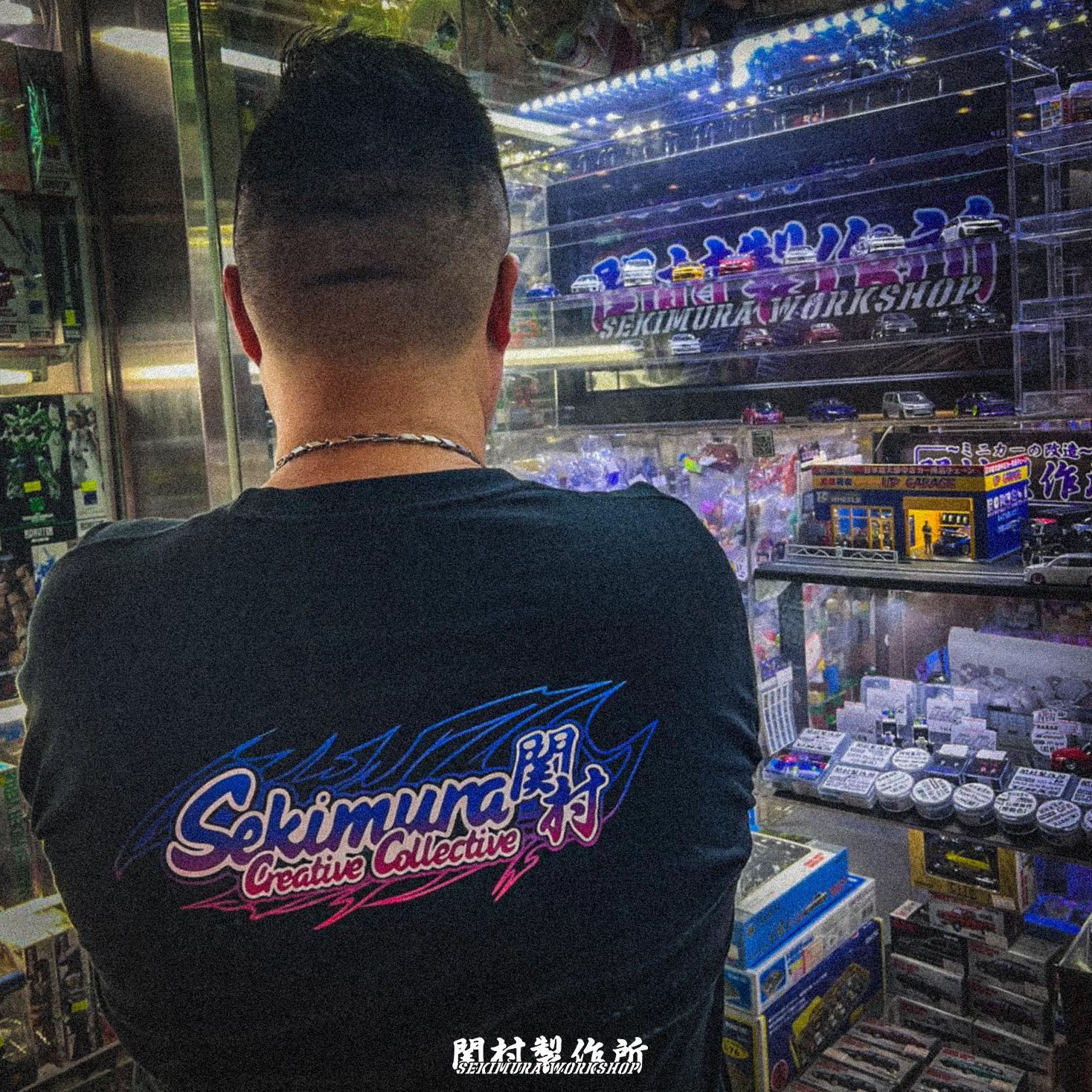 Black Sekimura T-shirt with large back graphic and bottom text