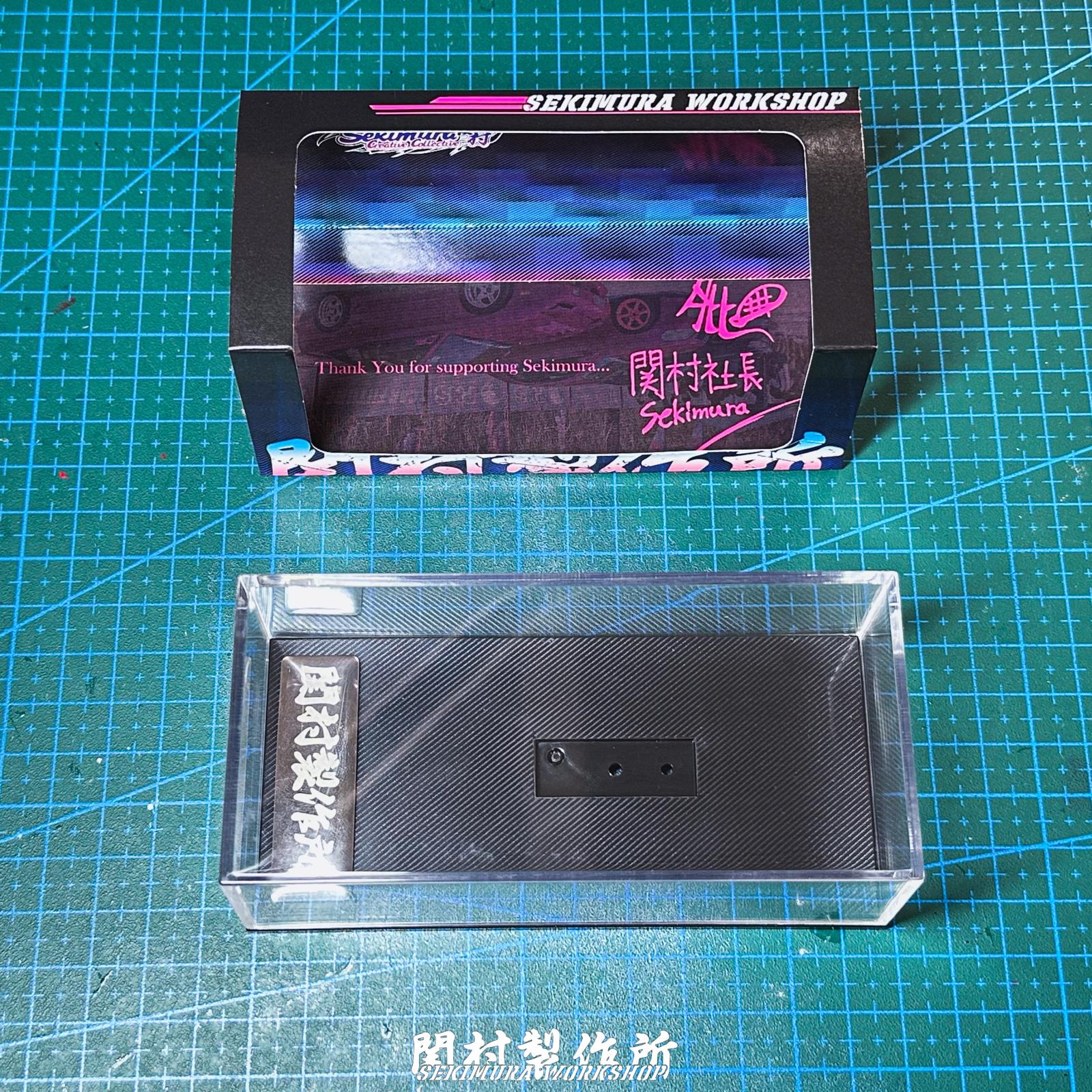 1/64 display box set with clear plastic tray and inner base holding a metal plate