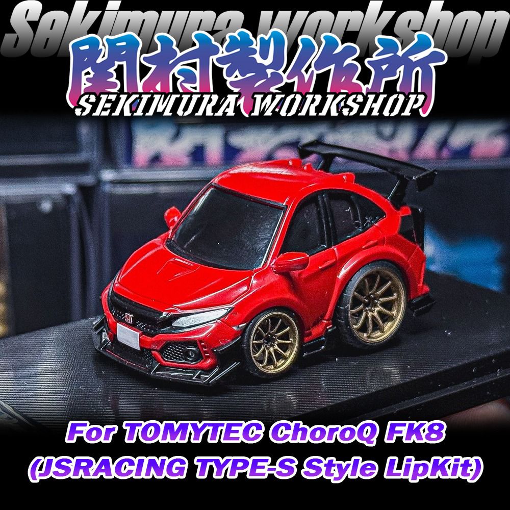 Red model car with black front lip and side aero, gold wheels.