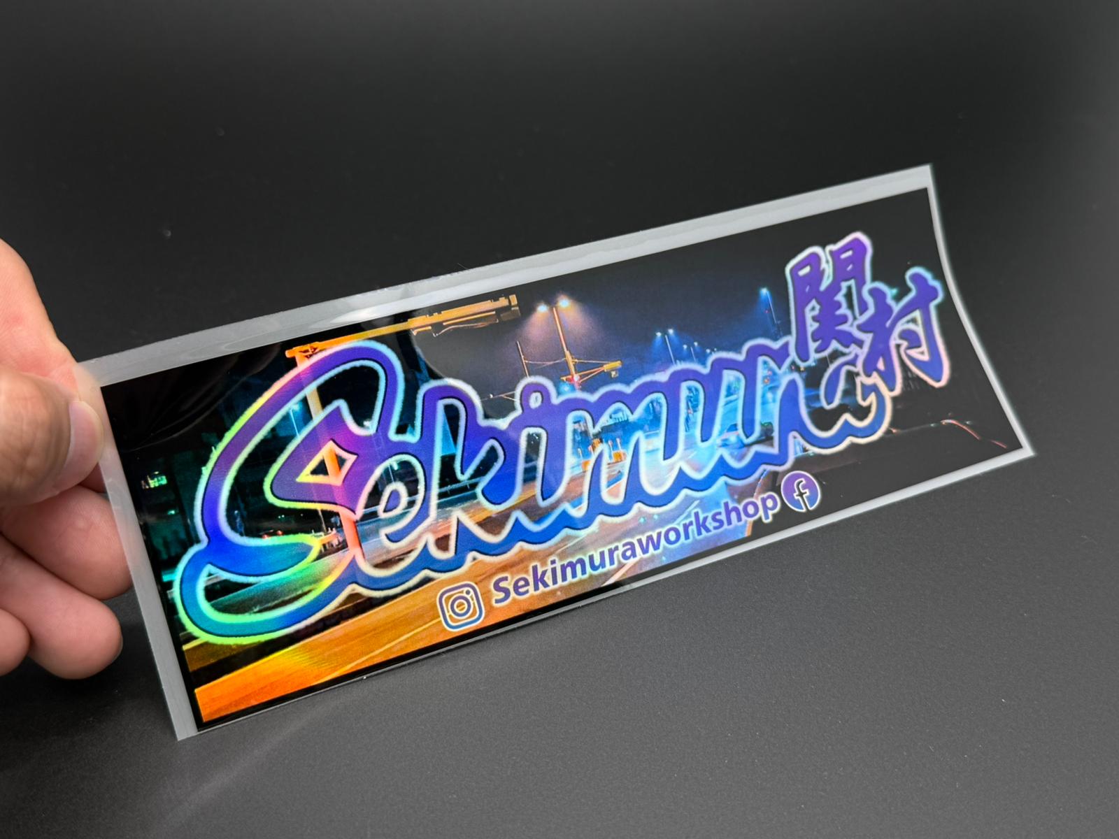 Hand-held Sekimura Original Type 4 sticker, rectangular with colorful logo text, 20x7 cm