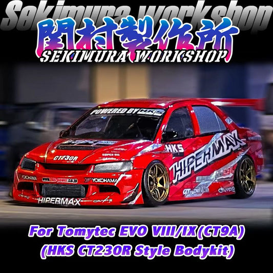 Red HKS Hipermax style model car with hood vents and large rear spoiler, gold wheels