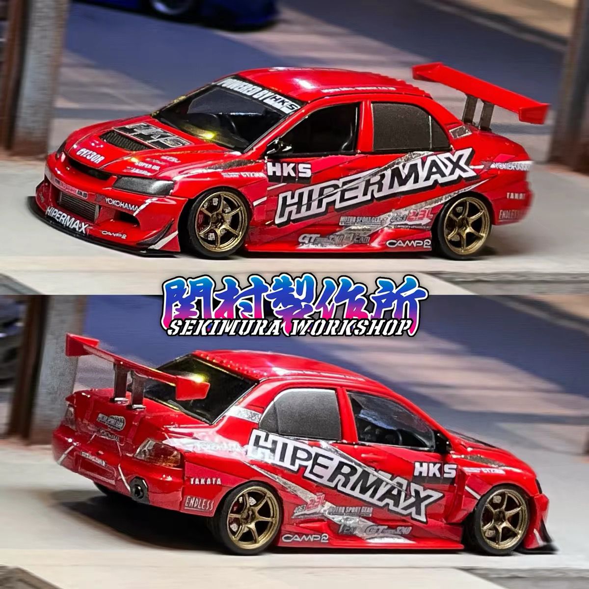 Red HKS Hipermax style model car, front three-quarter view, rear wing, gold wheels