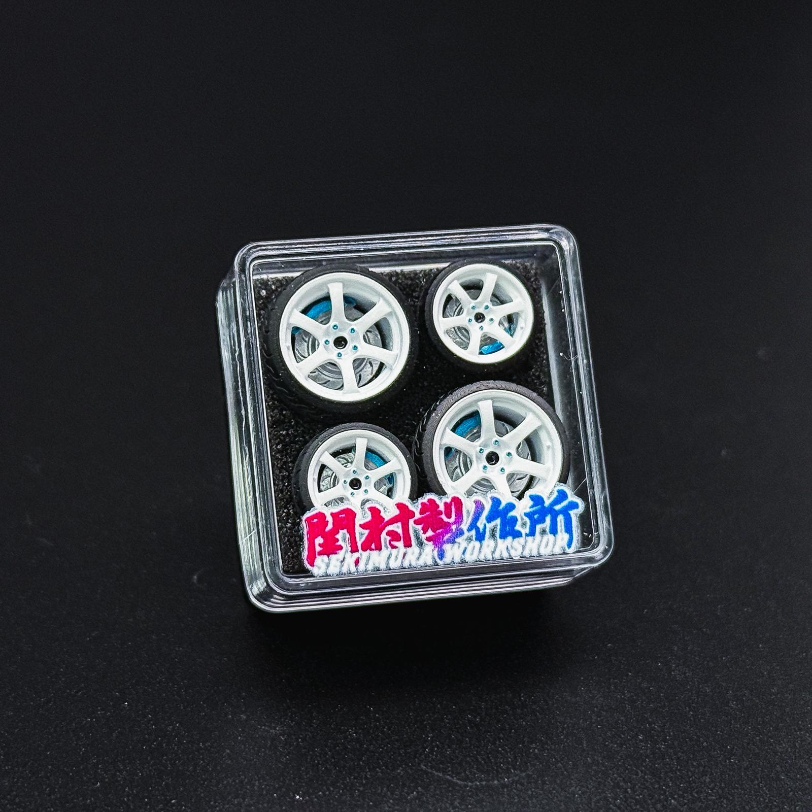 ChoroQ 57DR wheel set in clear case, white multi-spoke wheels with blue hubs