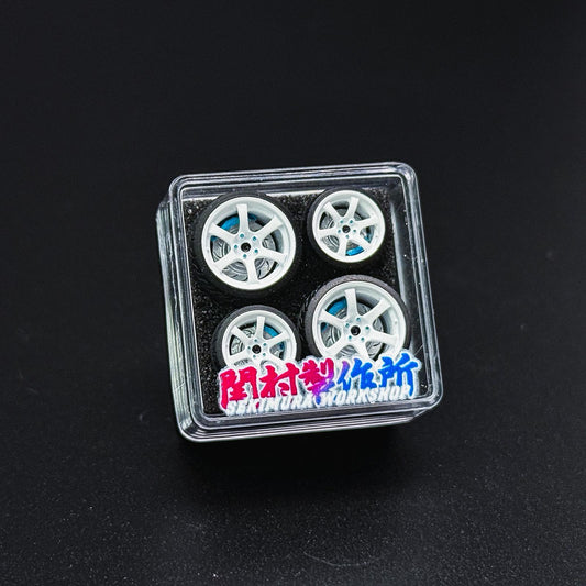 ChoroQ 57DR wheel set in clear case, white multi-spoke wheels with blue hubs