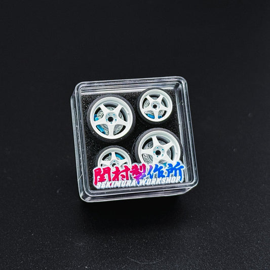 ChoroQ EVO wheels set in clear plastic case with four white rims