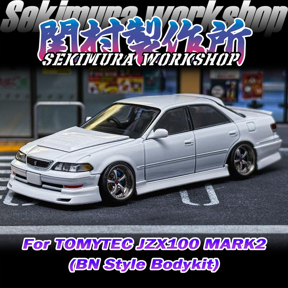 White JZX100 Mark2 model sedan with front lip and side skirts, three-quarter view