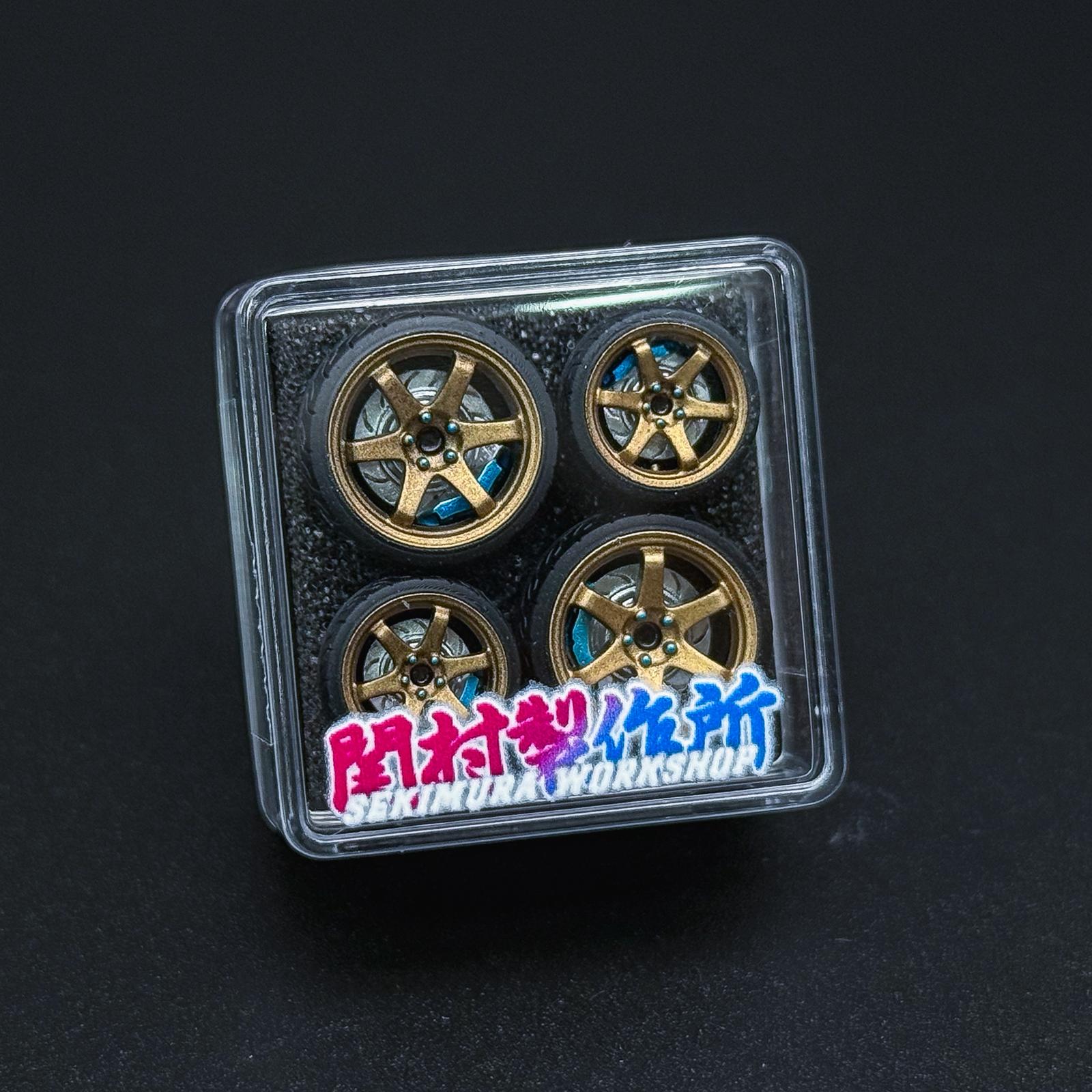 ChoroQ TE37 wheels in clear blister, bronze with blue accents, four-spoke rims