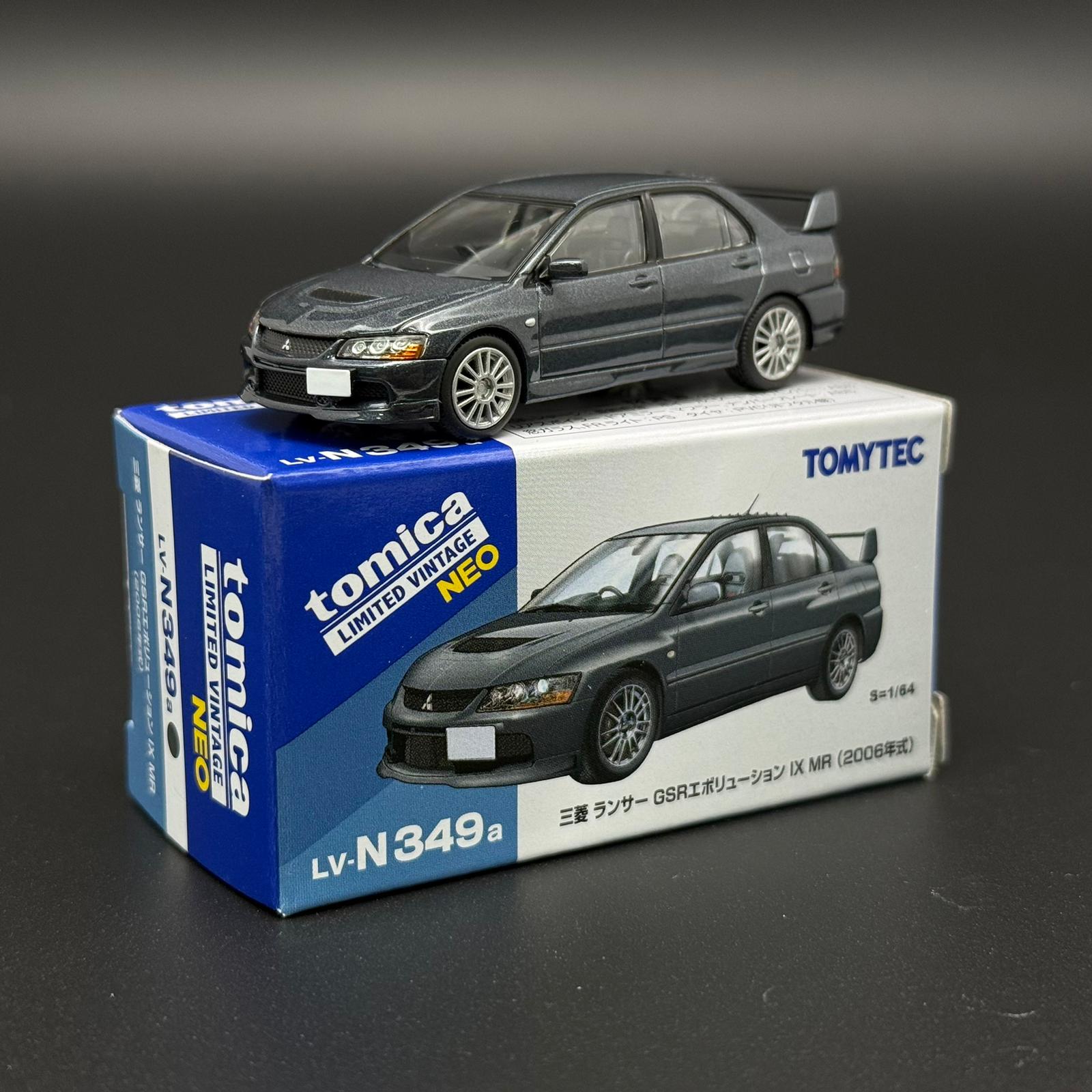 Gray die-cast car model with front-left 3/4 view and alloy-style wheels