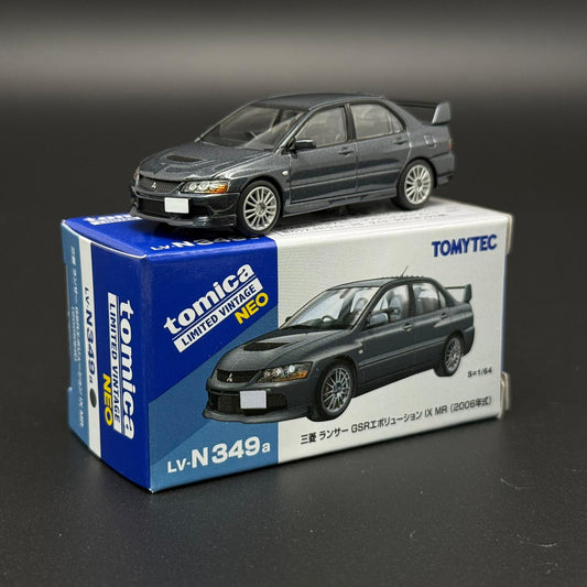 Gray die-cast car model with front-left 3/4 view and alloy-style wheels