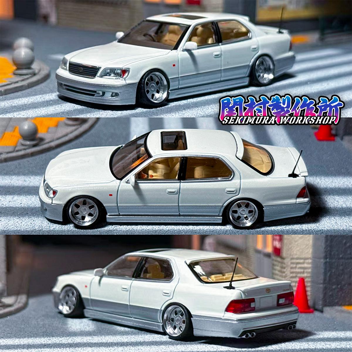 Light blue die-cast sedan with aftermarket body kit, top and side rear angles