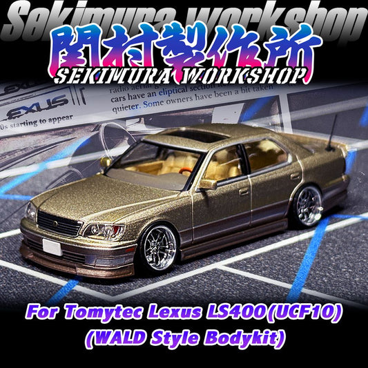 Two-tone gold sedan die-cast car with Wald-style body kit and chrome wheels