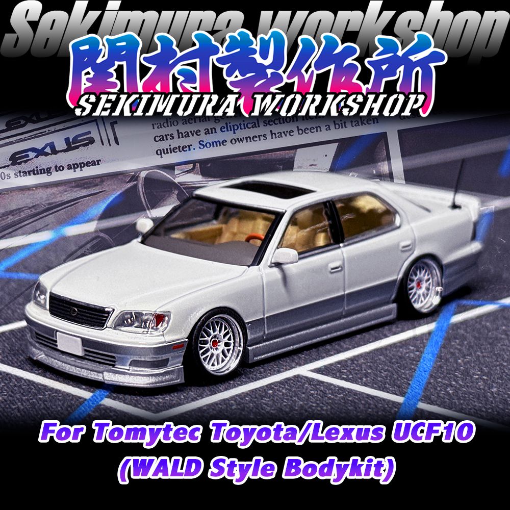 Two-tone white sedan die-cast car with Wald-style body kit and chrome wheels