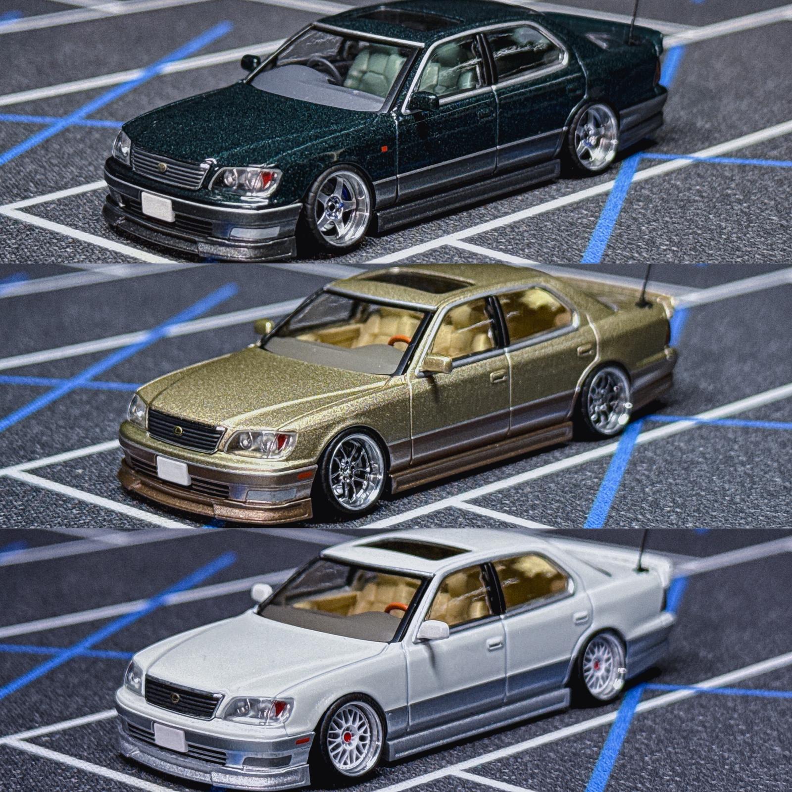 Three-view die-cast sedan lineup: dark green, gold, and white with Wald-style kit