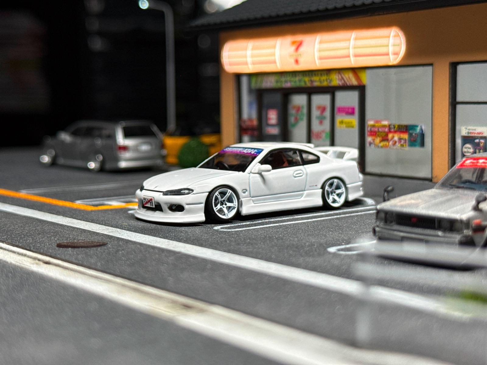 White sports car bodykit model with low stance, front and side view