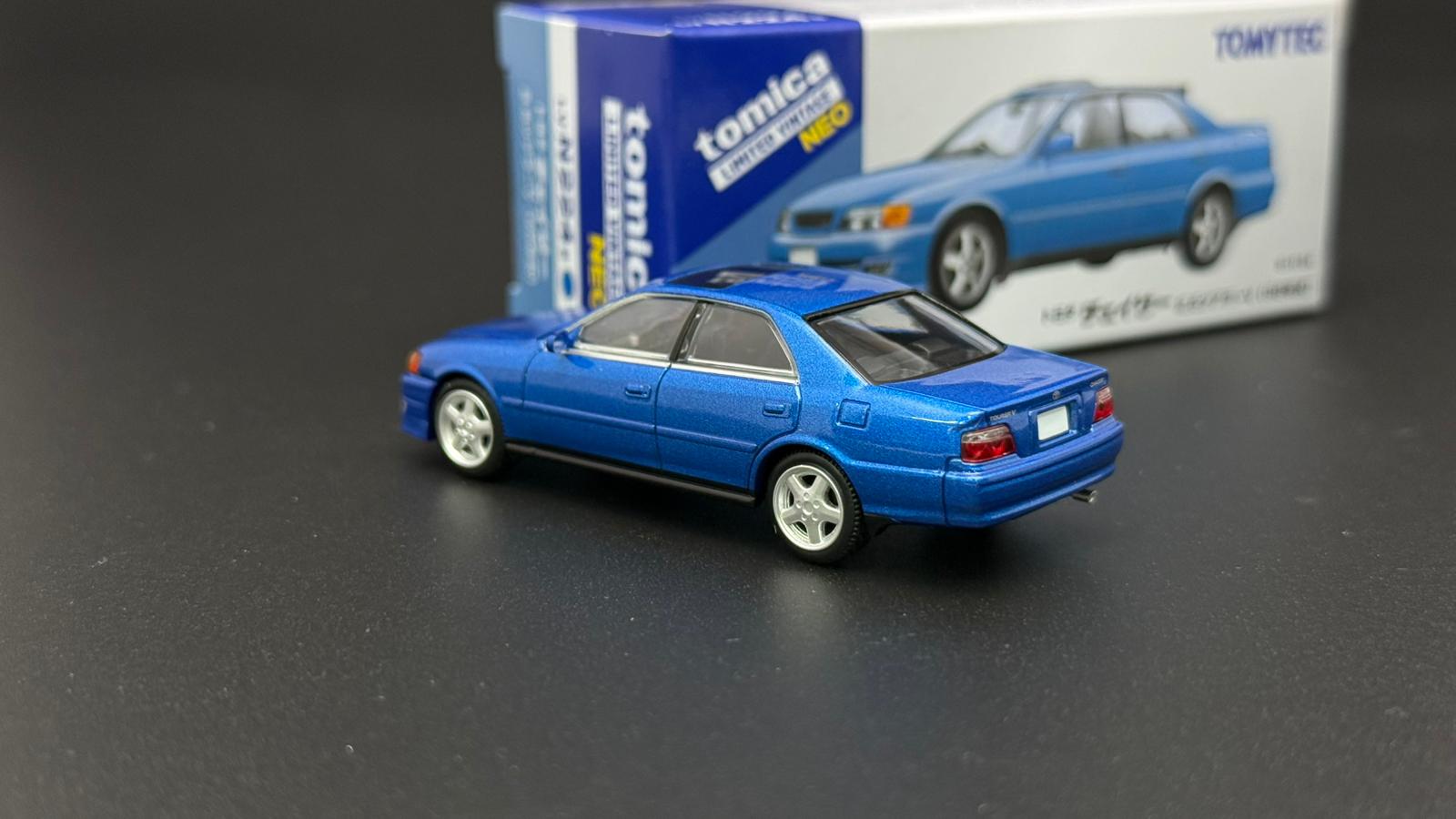 Blue JZX100 Chaser toy car model with TOMYTEC box, side front view