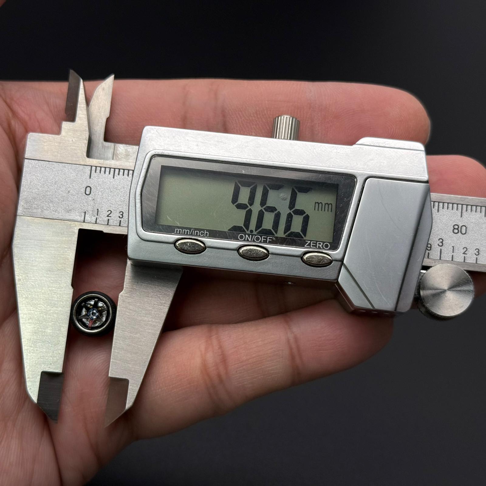 RPF01 wheels, metallic rim with visible wheel spokes; digital caliper for size