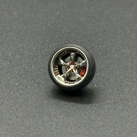 Single chrome metal model wheel with multi-spoke rim and red center detail