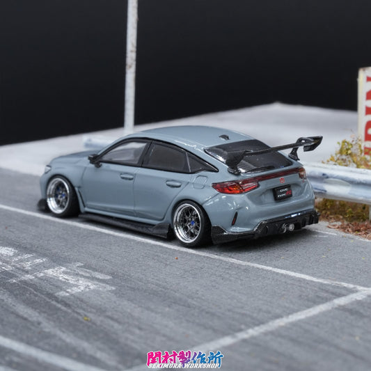 Light blue model car rear view with body kit, rear wing, side skirts, lowered stance