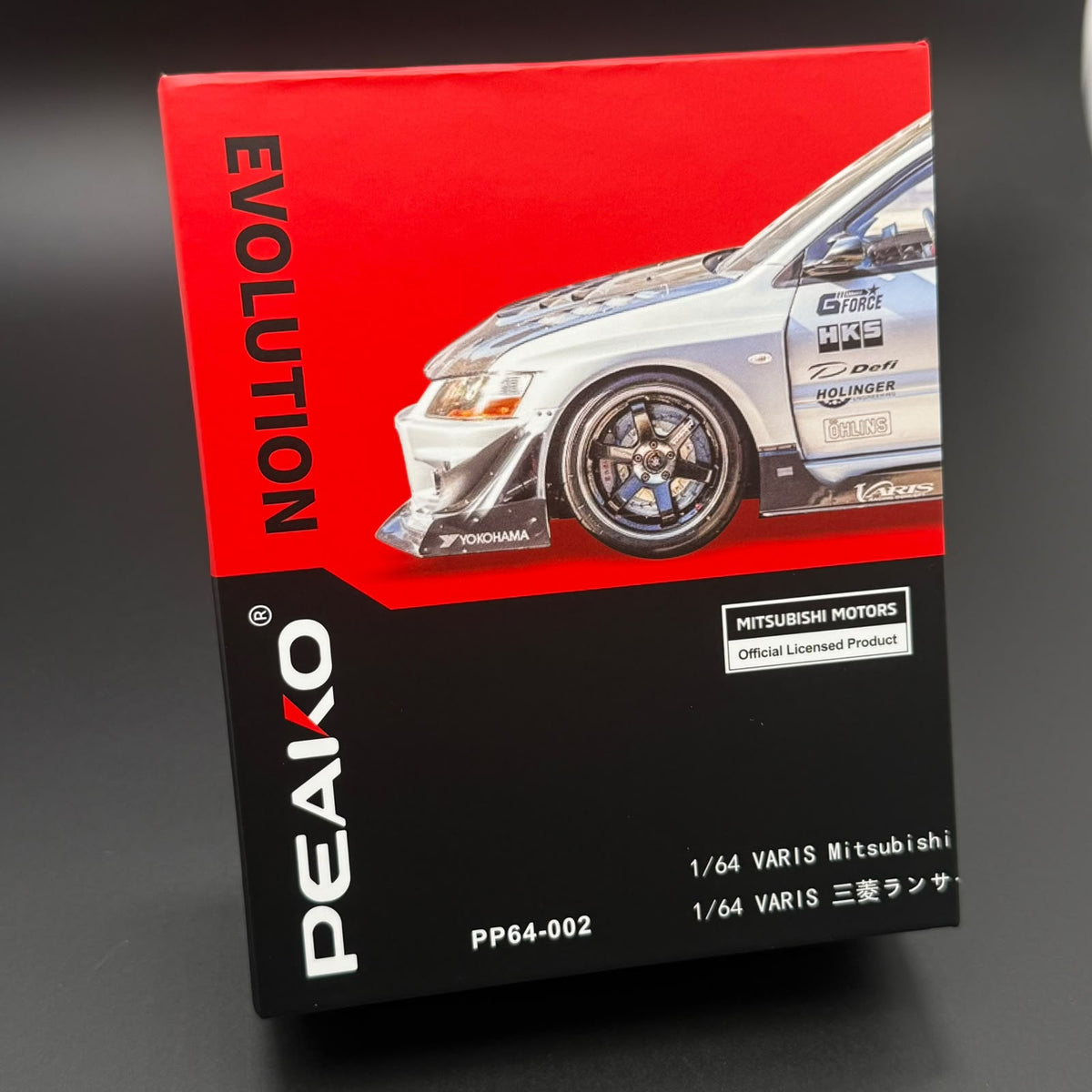 PEAKO 1/64 model car box with red and black design and front car artwork