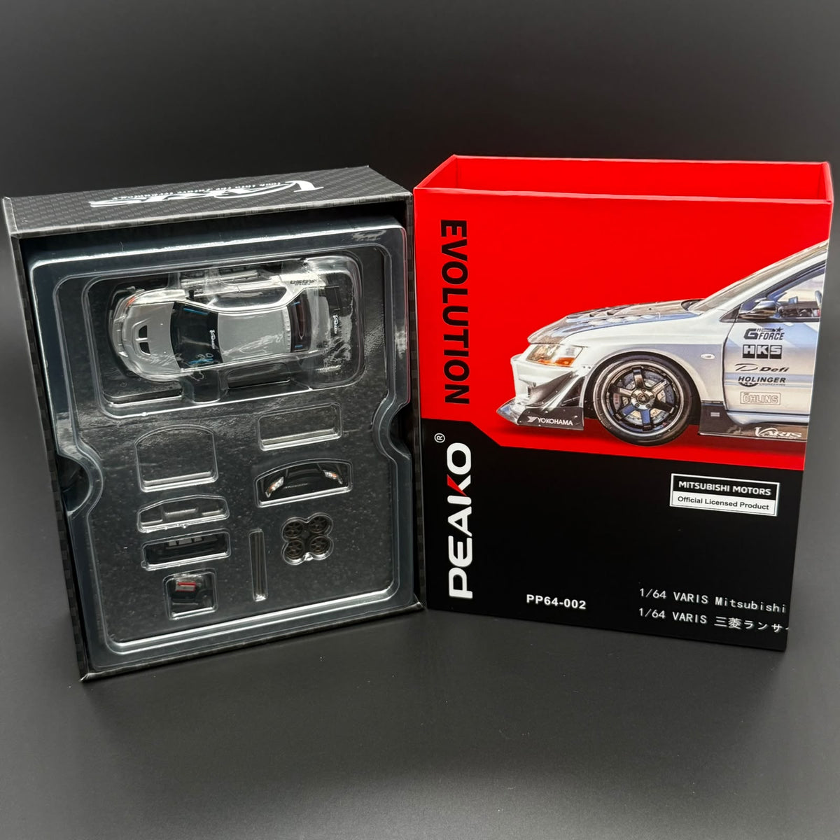 PEAKO 1/64 model car packaging with accessory tray and boxed car artwork