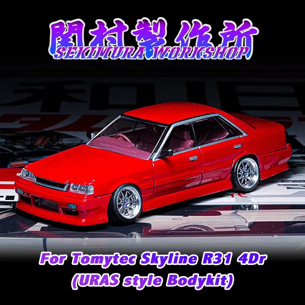 Red modified sedan scale model with chrome wheels and front bumper kit