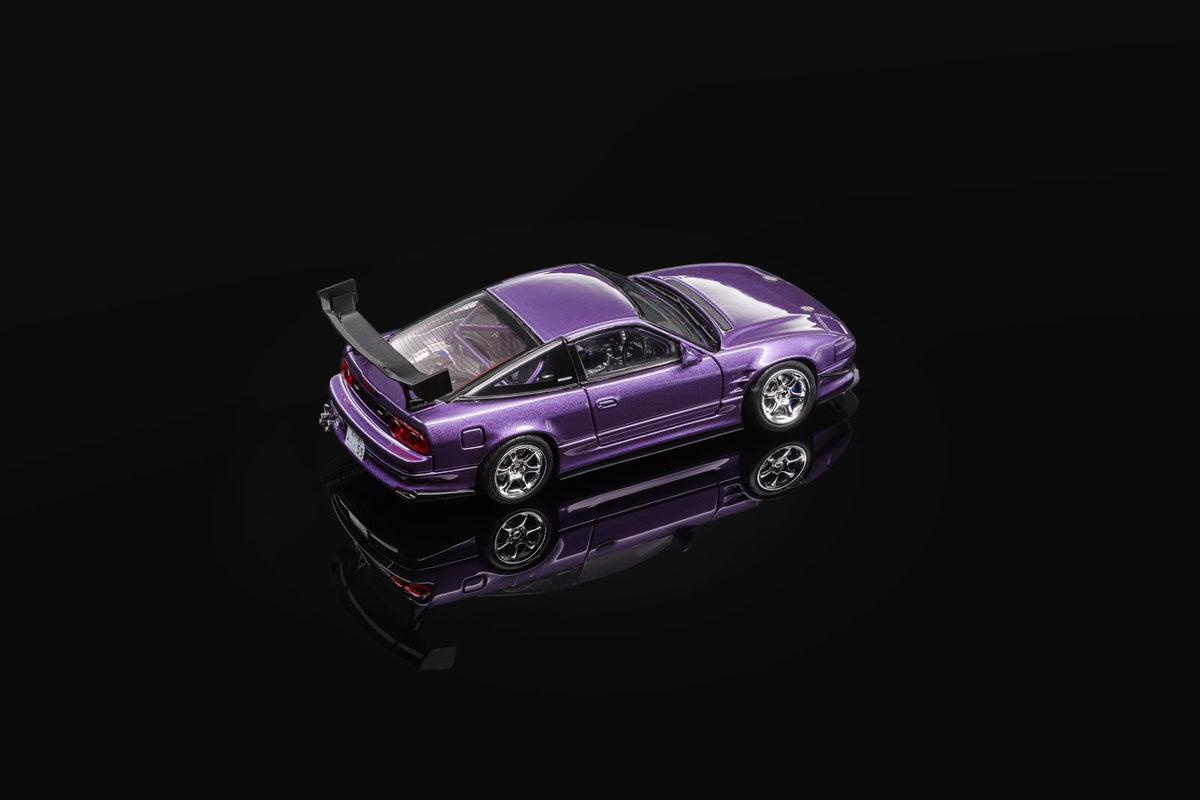 Purple 1/64 scale sports car model, angled side view with large rear wing