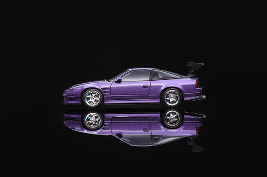 Purple 1/64 scale sports car model, front-left view with rear wing