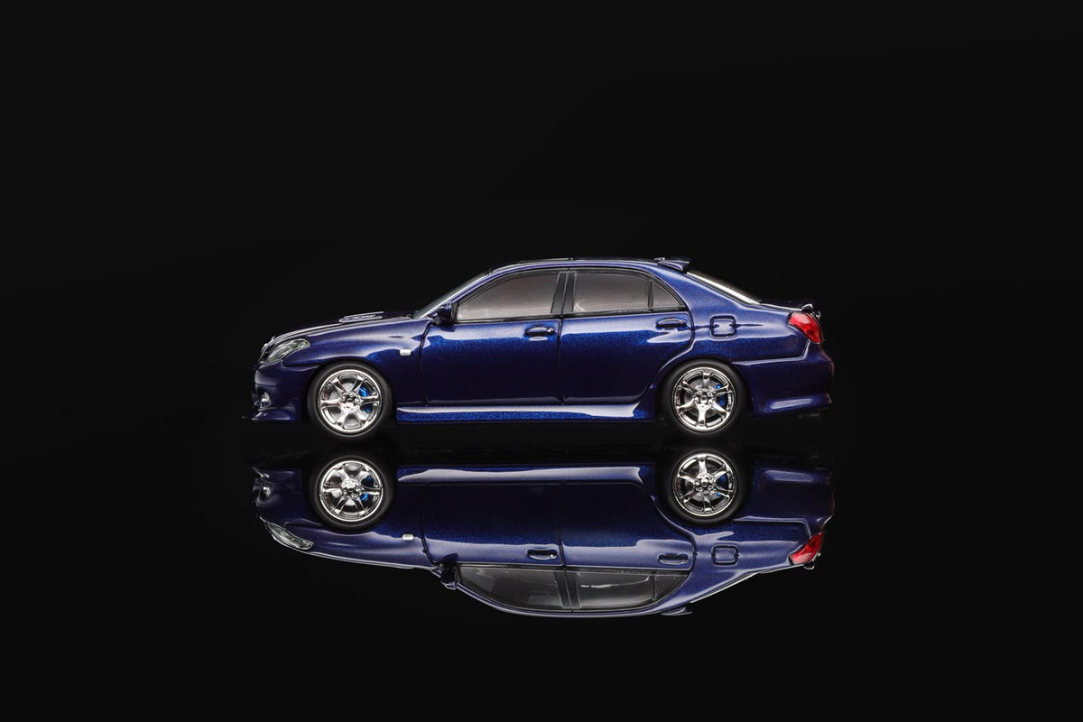 Blue 1/64 scale model sedan with silver wheels, shown from side view.
