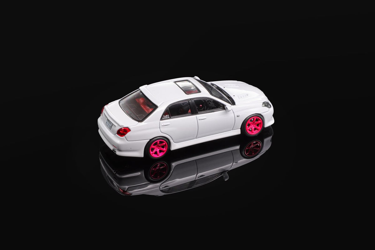 White 1/64 die-cast sports car model with pink wheels, front three-quarter view