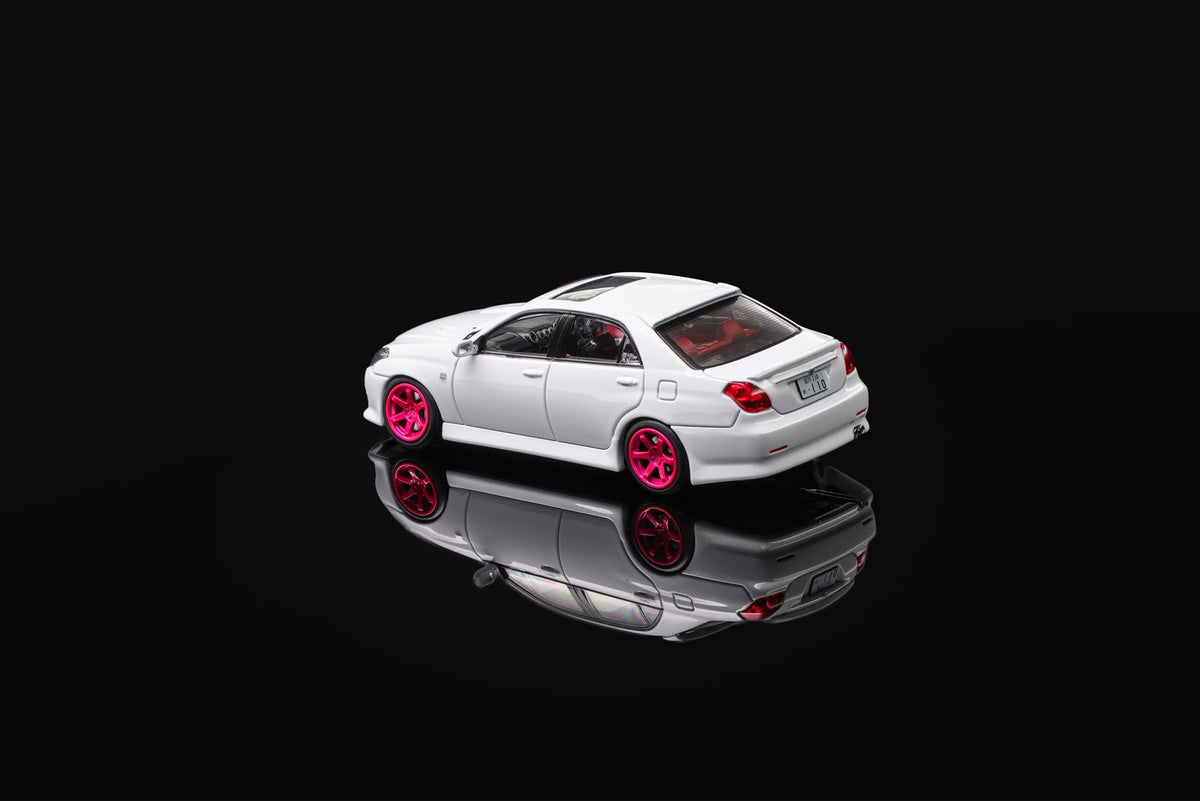 White 1/64 die-cast sports car model with pink wheels, rear three-quarter view