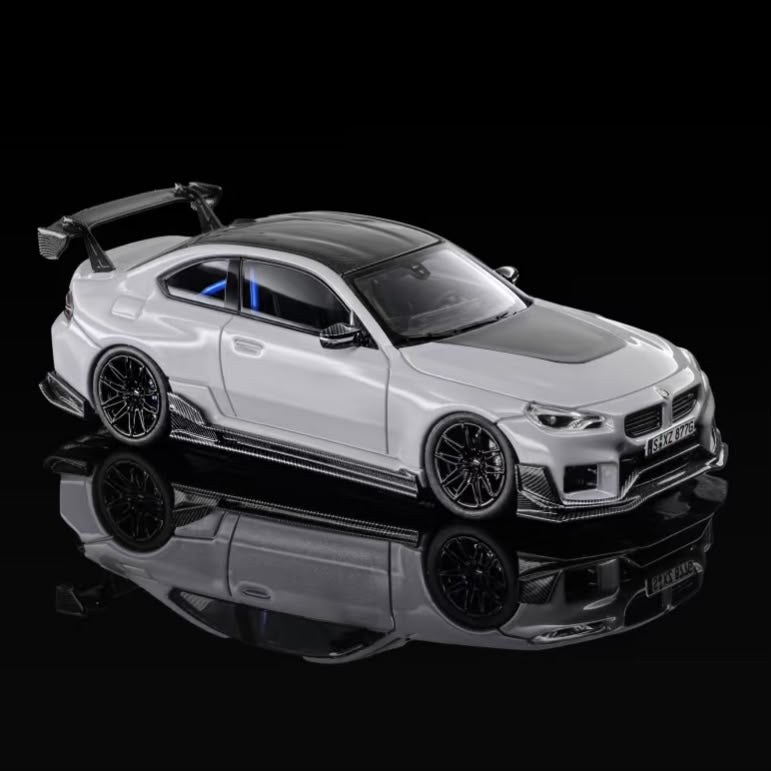 Grey coupe body kit, front three-quarter view with grille and front splitter