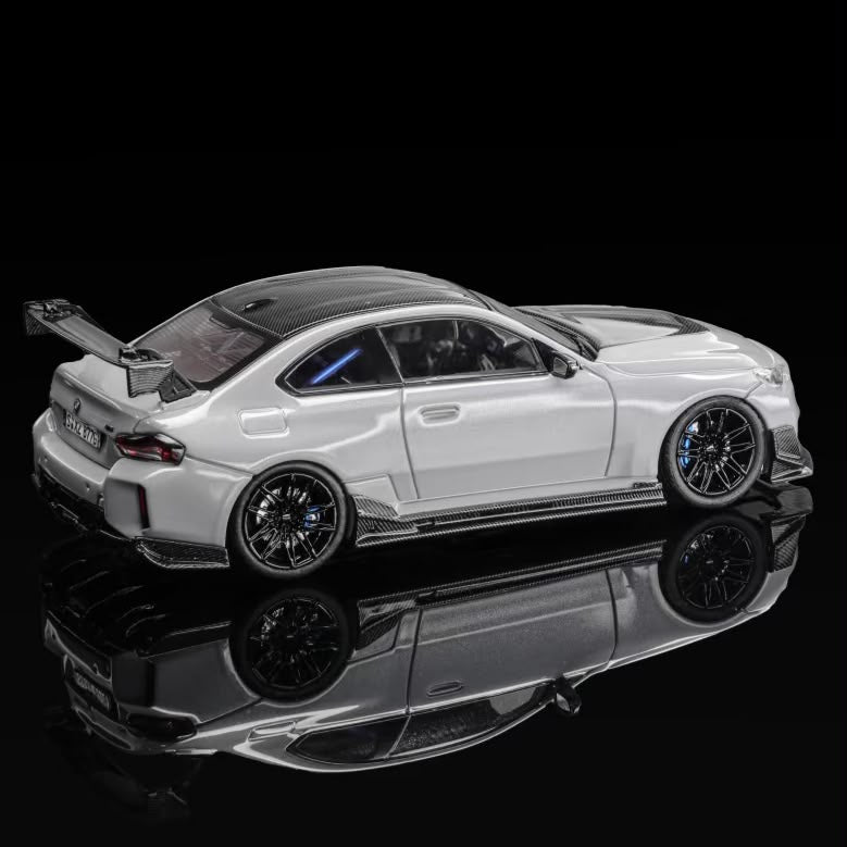 Grey coupe body kit, rear three-quarter view with side skirts and diffuser