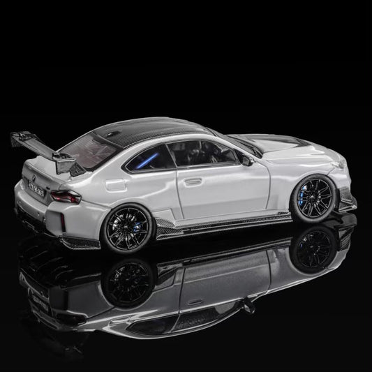Grey coupe body kit, rear three-quarter view with side skirts and diffuser