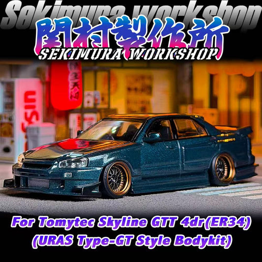 Dark gray-blue die-cast car model with front bumper and side skirts