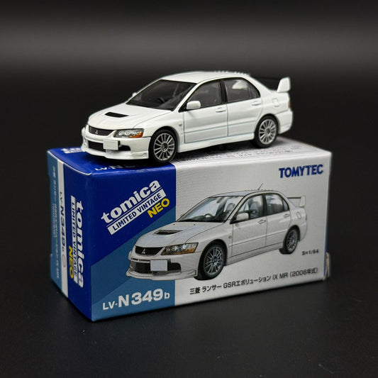 White die-cast car model with front-left 3/4 view and alloy-style wheels