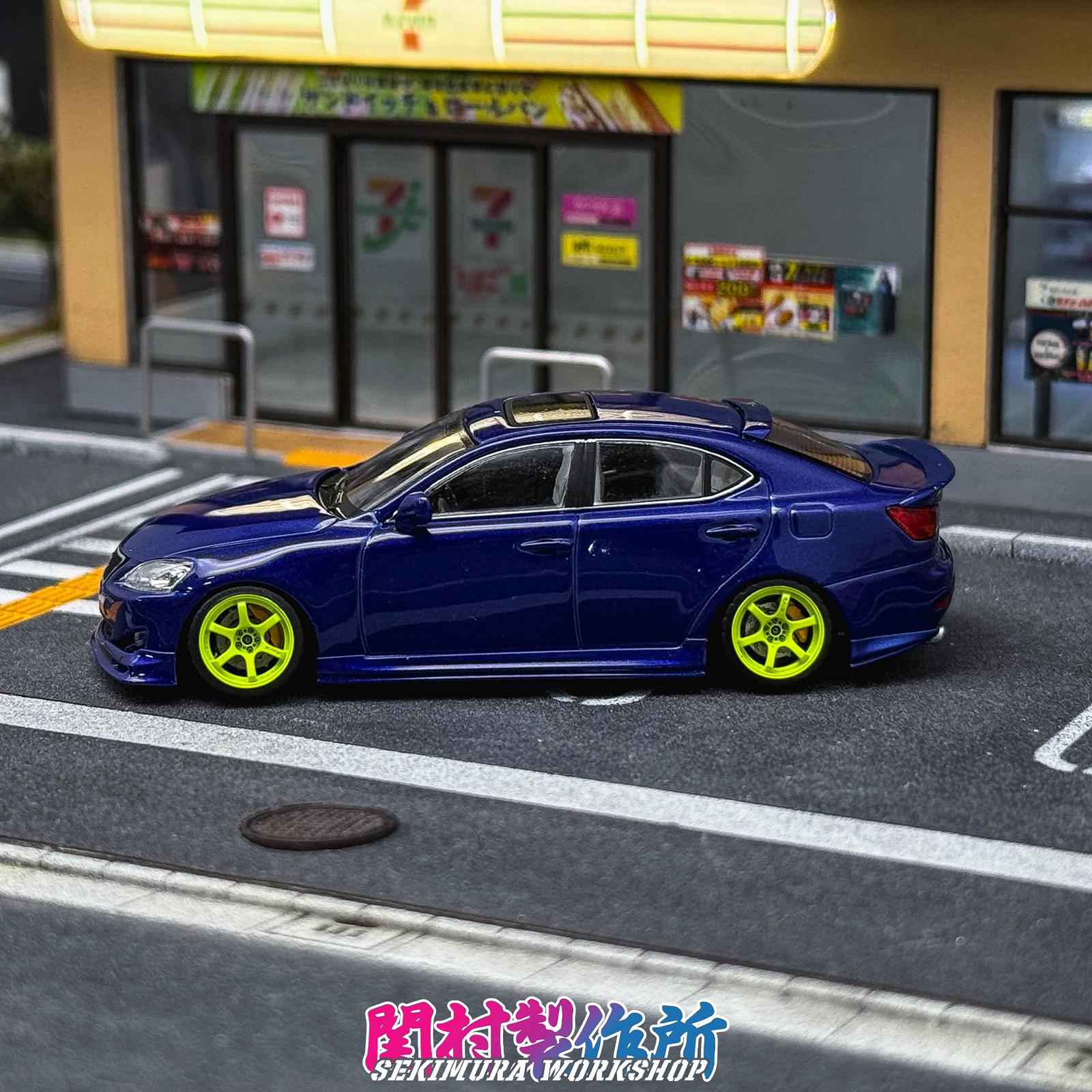 Blue Lexus IS350-style bodykit car with side skirts and rear spoiler, side view