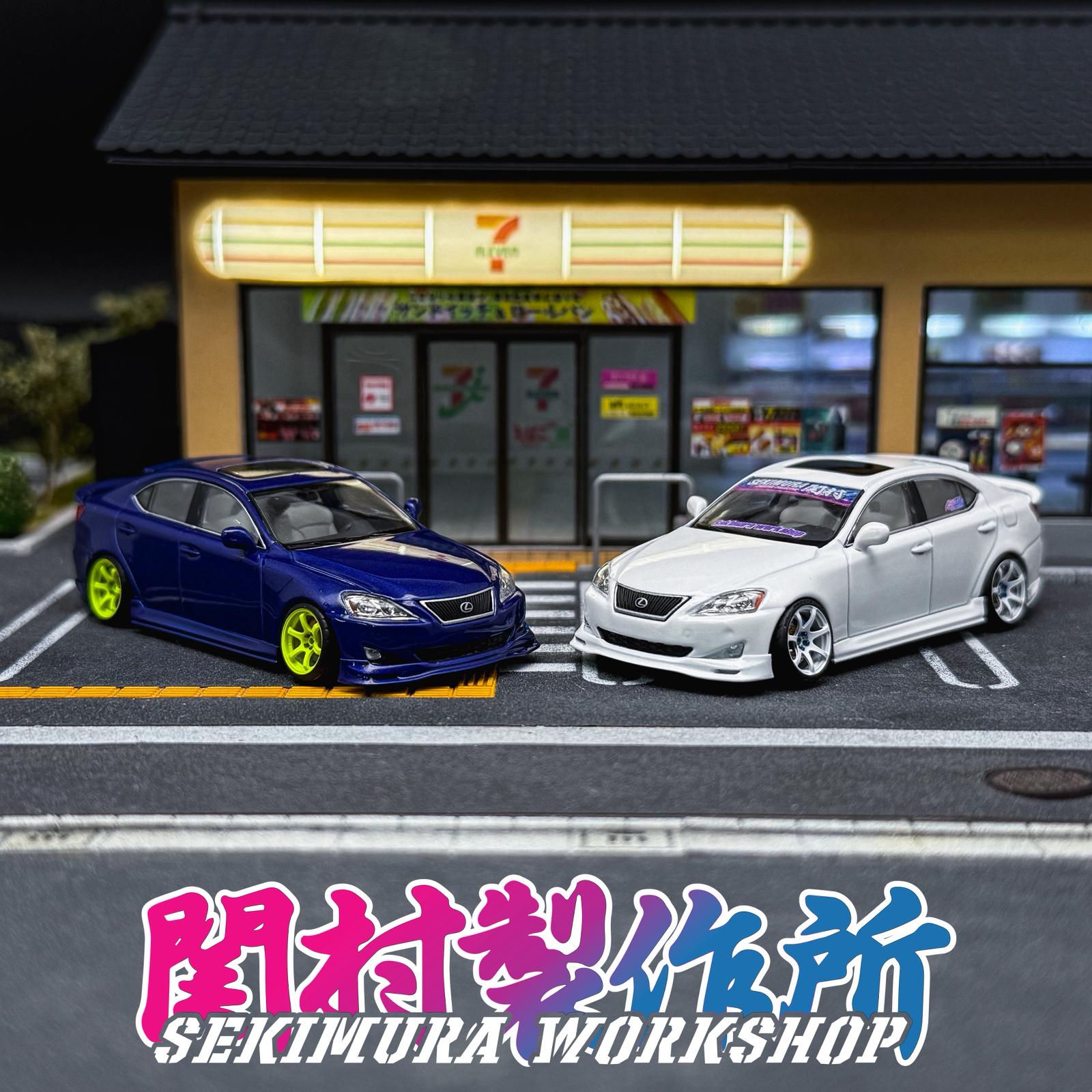 Blue and white Lexus IS350-style bodykit cars parked side by side, rear 3/4 view