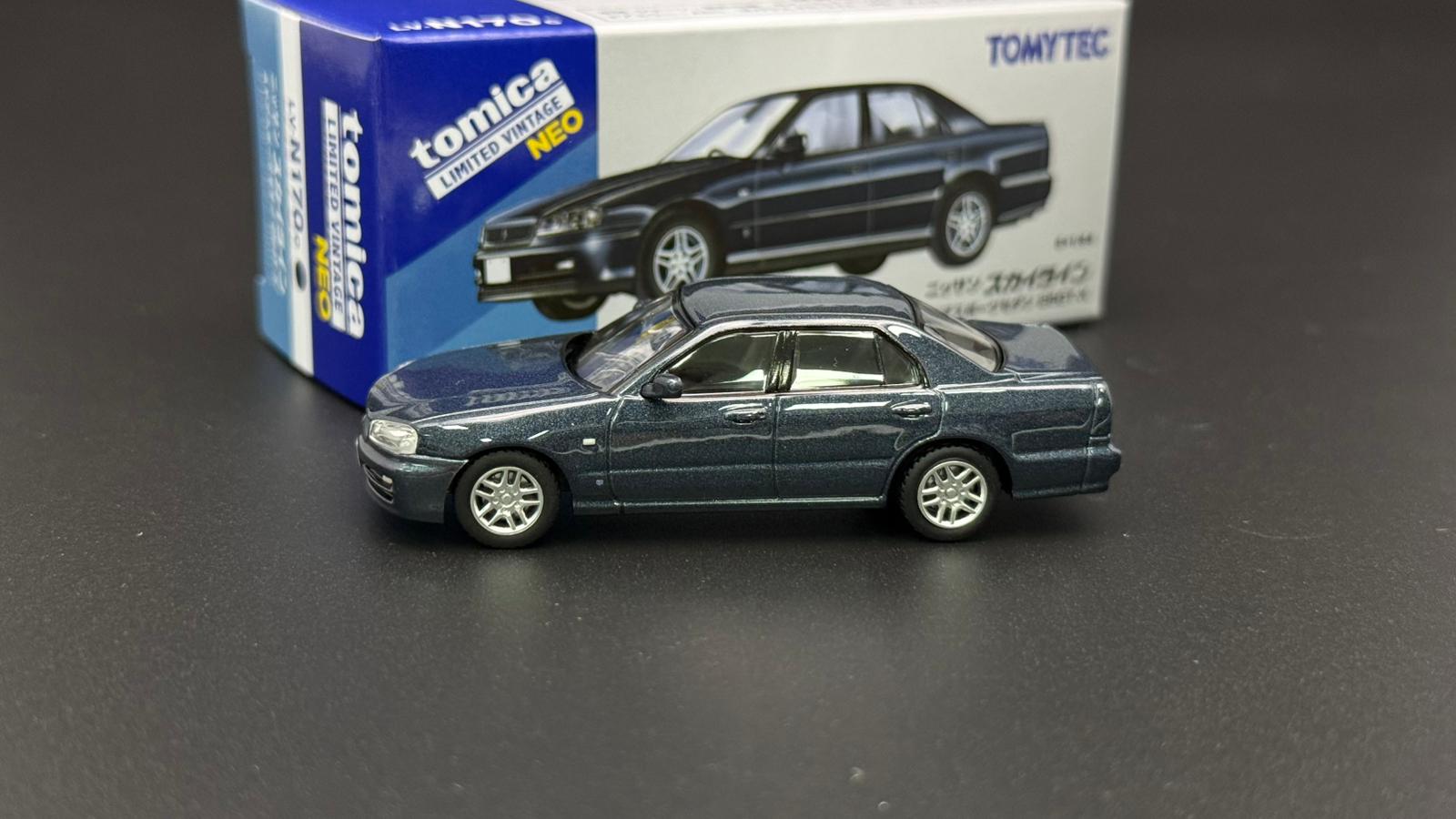 Tomytec 1/64 ER34 4-Door dark grey-blue model car, side view